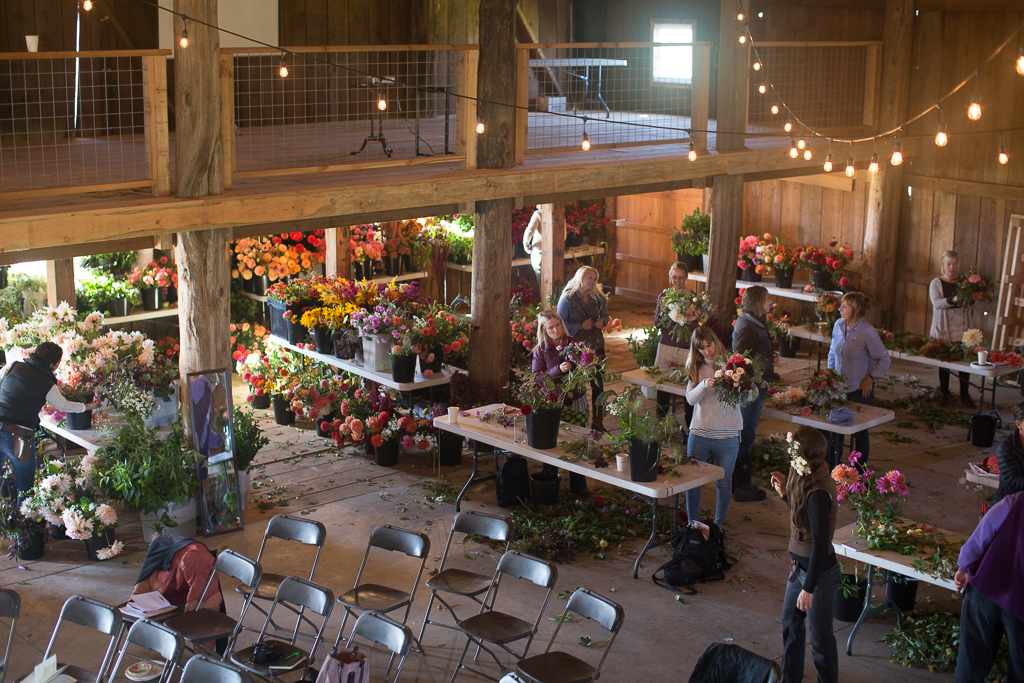 Students arranging local flowers at an on-farm Floret workshop