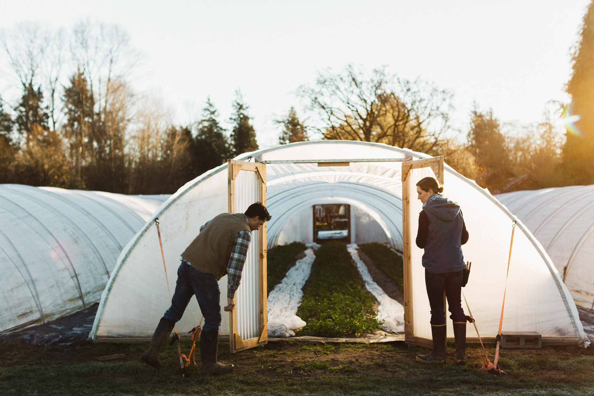 Erin and Chris Benzakein closing greenhouse doors