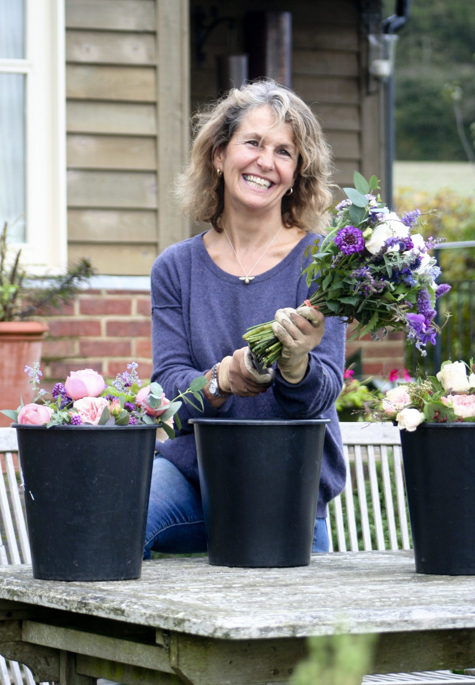 Rosebie Morton arranging bouquets