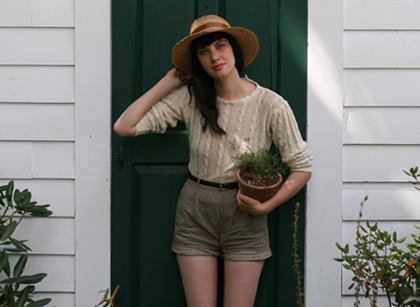 A woman holding a potted plant